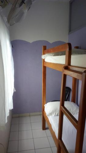 Postel nebo postele na pokoji v ubytování Moves Rasta Cottage