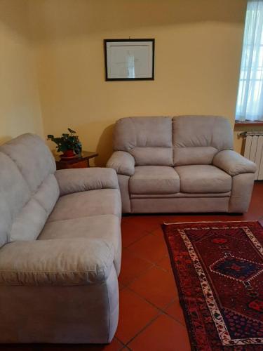 a living room with two couches and a couch at Valle degli Ulivi appartamento in Terni