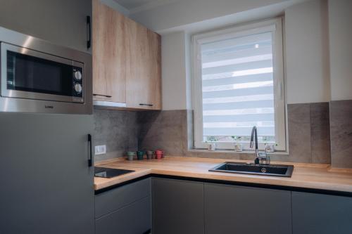 Η κουζίνα ή μικρή κουζίνα στο Bellissimo Apartments