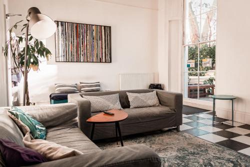 a living room with a couch and a table at Urbany Hostel London 18-40 Years Old in London