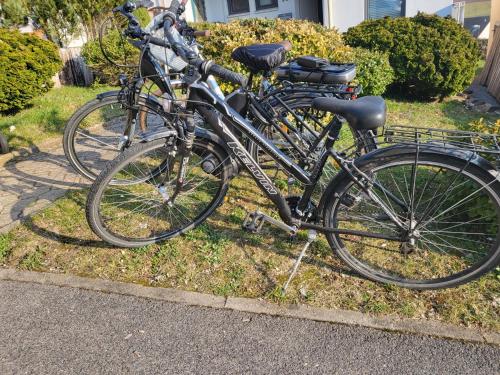 two bikes parked next to each other on the grass at Ferienwohnung AM HOCHBERG in Bad Kissingen