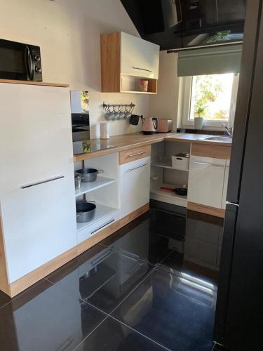 Kuchyň nebo kuchyňský kout v ubytování Apartament Hanuszówka