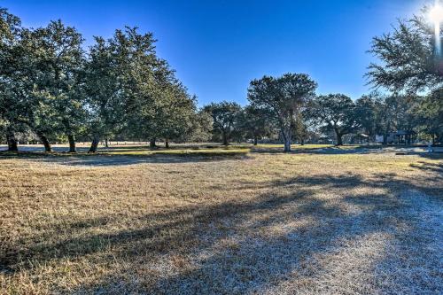 a field of grass with trees in the background at 1 Mi to Belton Lake Peaceful Temple Escape! in Temple