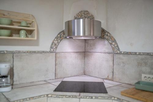 a pot on top of a counter in a kitchen at Country House Trata in Kranjska Gora