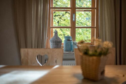 a table with a window in a room at Country House Trata in Kranjska Gora