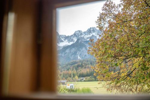 a view of a mountain from a window at Country House Trata in Kranjska Gora