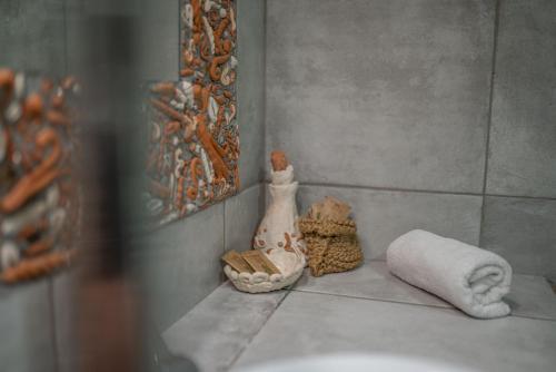 a bathroom counter with a towel and a towel roll at Country House Trata in Kranjska Gora