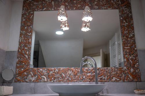 a bathroom with a sink and a mirror at Country House Trata in Kranjska Gora