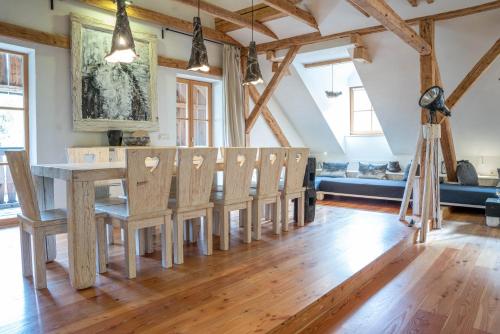 a dining room with a table and chairs at Country House Trata in Kranjska Gora