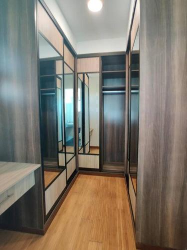 a hallway with a row of mirrors in a room at English Point Residence Beach Apartments Mombasa in Mombasa