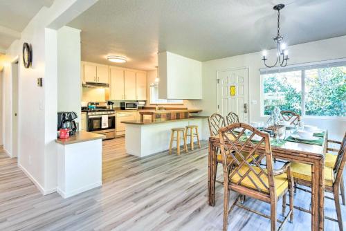 a kitchen and dining room with a table and chairs at Furnished Deck and Fire Pit Sherwood Forest Cabin in Twain Harte