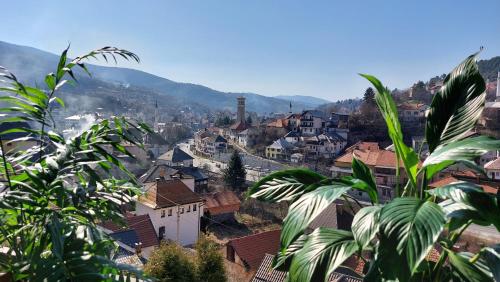 a view of a city with houses and mountains at Panorama Travnik in Travnik