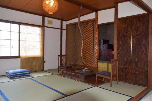 a living room with a rug on the floor at Blue 200-1 / Vacation STAY 3808 in Utasutsu