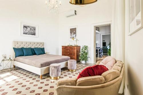 Postel nebo postele na pokoji v ubytování Grande Casa al Mercato di Ortigia