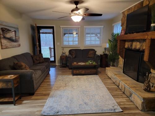 a living room with a couch and a fireplace at Just Breathe in Dandridge