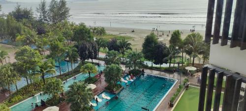 an aerial view of a pool at the beach at Timurbay Seaview & Poolview by Zuhayr Suite in Kuantan