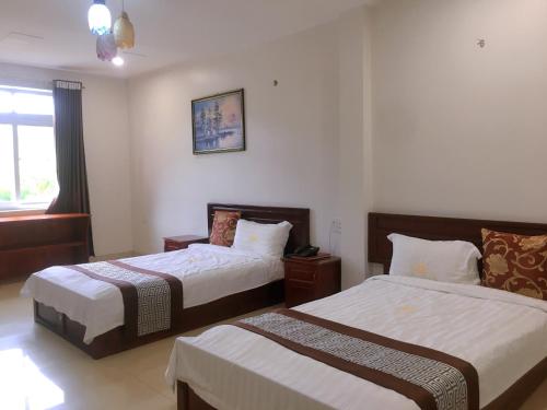Ένα ή περισσότερα κρεβάτια σε δωμάτιο στο SONG HONG VIEW HOTEL