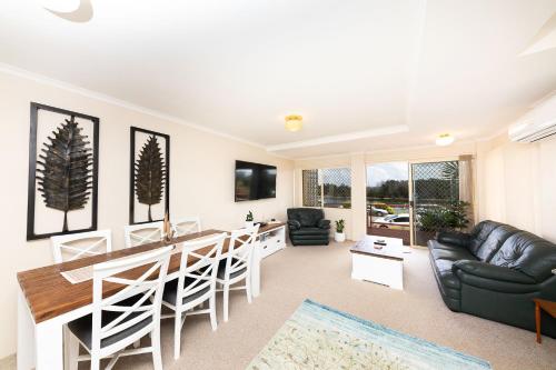 a living room with a bar and a couch at Haven Waters Unit 2 in Forster