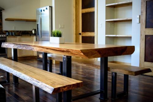 a wooden table in a kitchen with two benches at Alpenglow 1 in Yosemite West