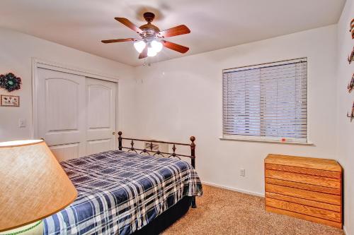 a bedroom with a bed and a ceiling fan at Bears Den & Little Bear in Yosemite West