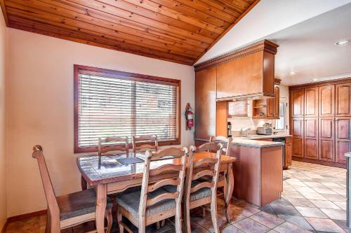 a dining room with a table and chairs in a kitchen at Fishermen’s Oasis in Oakhurst