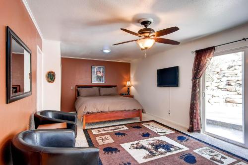 a bedroom with a bed and a ceiling fan at Fishermen’s Oasis in Oakhurst