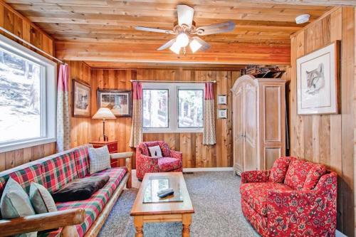 a living room with a couch and two chairs and a ceiling fan at Edelweiss in Yosemite West