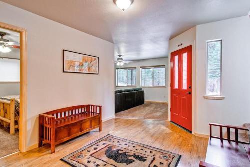 a living room with a red door and a couch at Explorers Retreat in Yosemite West