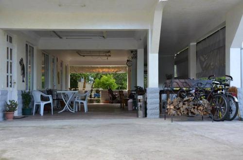 a group of bikes parked outside of a house at TJ Guest House in Makhinjauri
