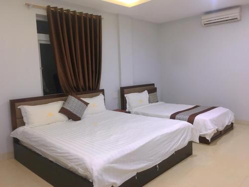 Ένα ή περισσότερα κρεβάτια σε δωμάτιο στο SONG HONG VIEW HOTEL