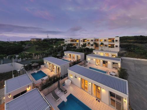 an aerial view of a house with a swimming pool at Crystal Villa Imgya in Miyako-jima