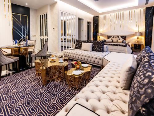 a living room with a couch and a table at Ilci Residence Hotel in Ankara