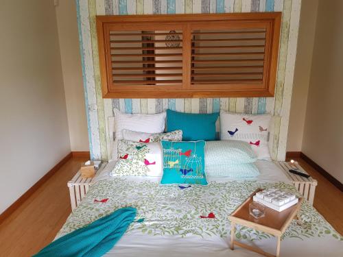 a bedroom with a bed with a headboard at Port McCrae in McCrae
