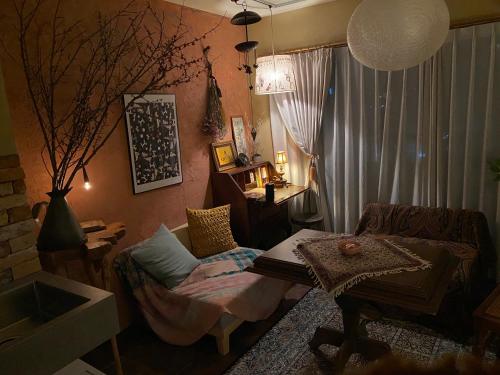 a living room with a couch and a table at TOE LIBRARY Tokyo Asakusa in Tokyo
