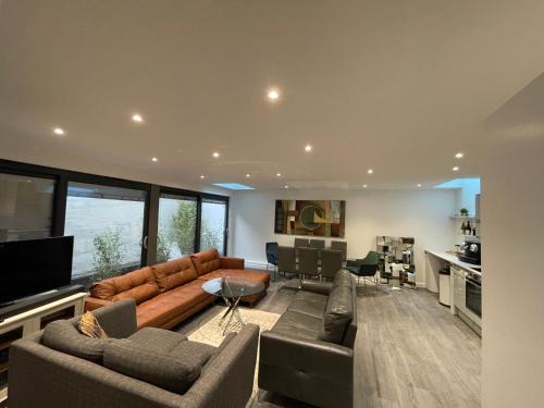 a living room with a couch and a table at 4 Islington Park Street in London