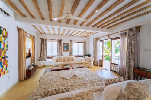 Кровать или кровати в номере La Villa de Victor Kigomani