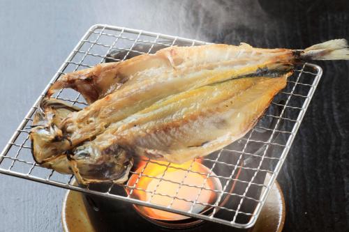 a piece of fish sitting on a cooling rack at Boso Shirahama Umisato Hotel in Minamiboso