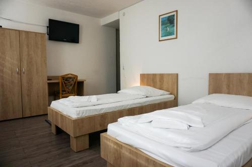 Postel nebo postele na pokoji v ubytování Hotel Kreuz