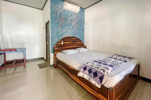 Lova arba lovos apgyvendinimo įstaigoje Ekas Beach Guesthouse Mitra RedDoorz
