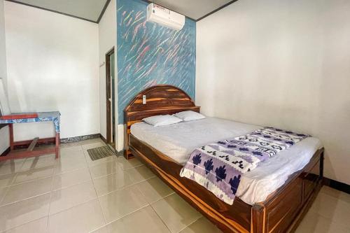 Postel nebo postele na pokoji v ubytování Ekas Beach Guesthouse Mitra RedDoorz