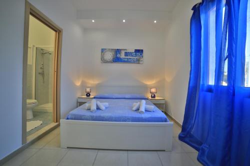 A bed or beds in a room at Meraviglie del Salento