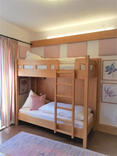a bunk bed with two bunk beds in a room at Haus Montana in Lermoos