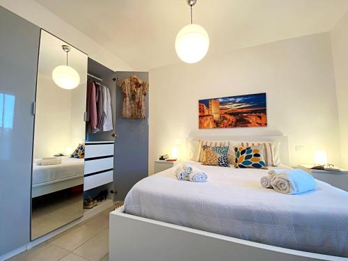 Postel nebo postele na pokoji v ubytování DomoMea - DonnaPabla