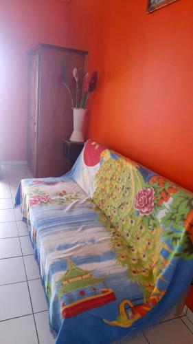 Ένα ή περισσότερα κρεβάτια σε δωμάτιο στο Appartement charmant à Capesterre-de-Marie-Galante, vue sur mer