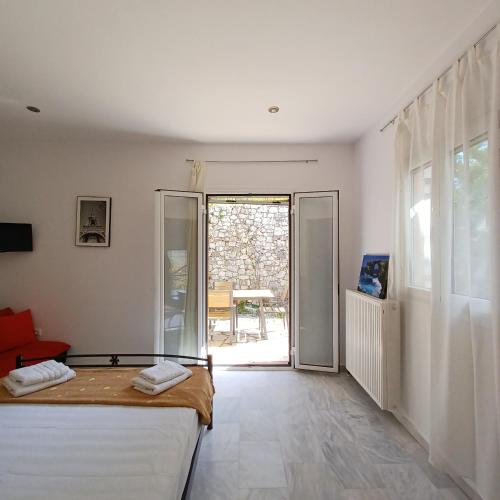 Ένα ή περισσότερα κρεβάτια σε δωμάτιο στο Villa Syvros