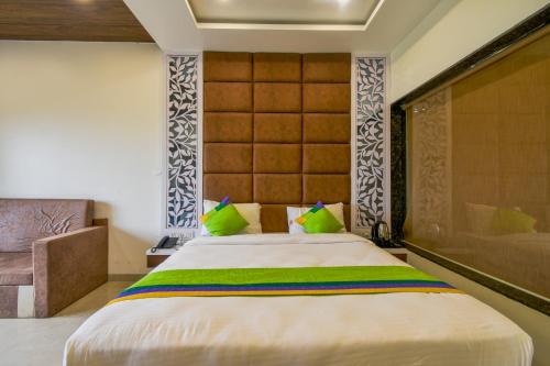 Ein Bett oder Betten in einem Zimmer der Unterkunft Treebo Prince Palace