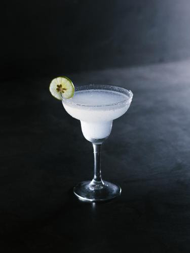 a drink with a slice of lime in a glass at Harding Boutique Hotel in Ahangama