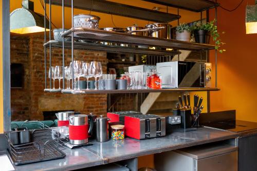 a kitchen with a counter with appliances on it at Rooms by Green Room in Leeds