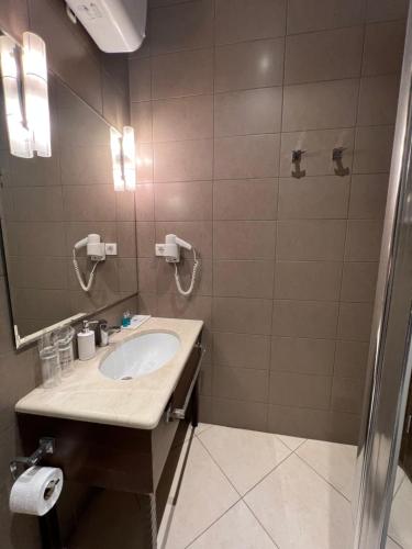 a bathroom with a sink and a mirror at Manjež Centar in Belgrade