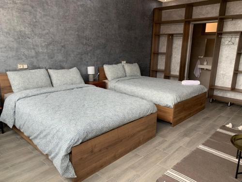 a bedroom with two beds in a room at Riad L'Aéroport in Marrakech